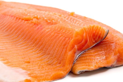detail of salmon trout fillet over white background