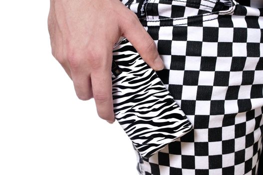 Closeup of zebra pattern cell phone and checkered pattern pants style