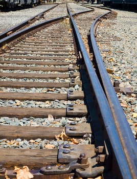 Old Railroad Tracks at a Junction on a Sunny Day