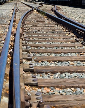 Old Railroad Tracks at a Junction on a Sunny Day