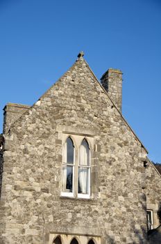 Detail of the side of an old stone house