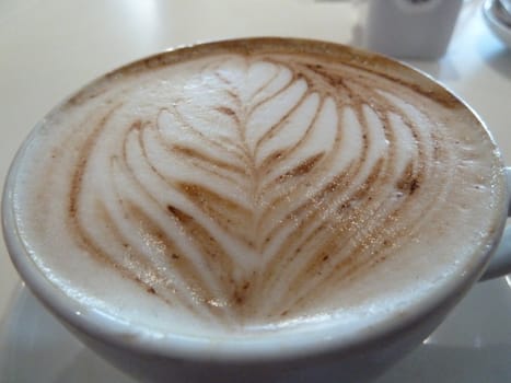 delicious cappuccino in a big cup