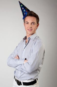 Portrait of a young man in formal attire with a New Year's gifts in their hands