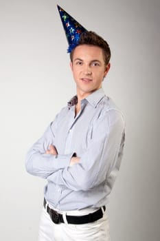 Portrait of a young man in formal attire with a New Year's gifts in their hands