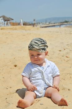 Cute little boy playing on the beach