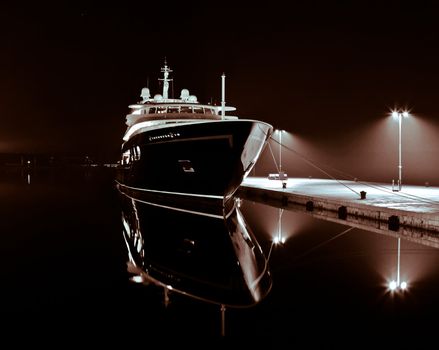 modern yacht in autumn night