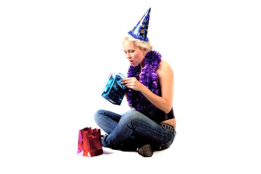 Young and beautiful girl with gifts waiting for the Christmas and New Year