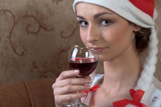 Young and beautiful girl with gifts waiting for the Christmas and New Year