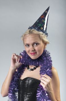 Young and beautiful girl with gifts waiting for the Christmas and New Year