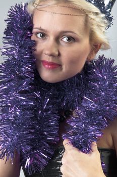 Young and beautiful girl with gifts waiting for the Christmas and New Year