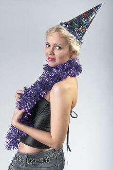 Young and beautiful girl with gifts waiting for the Christmas and New Year
