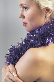 Young and beautiful girl with gifts waiting for the Christmas and New Year