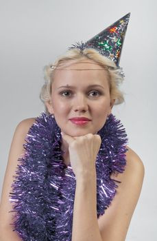 Young and beautiful girl with gifts waiting for the Christmas and New Year