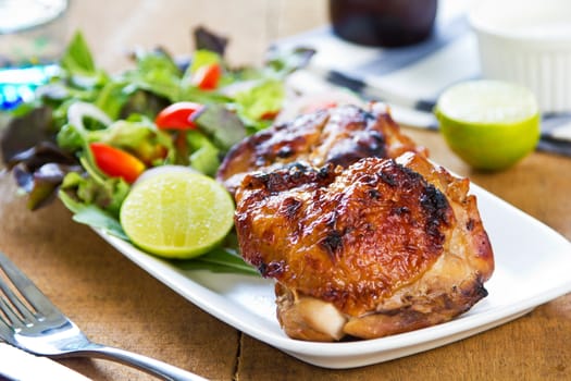 Grilled chicken with lettuce and rocket salad by sour cream dressing