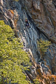Rock climber on High cliff
