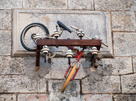 bicycle thrown on rotten electrical frame