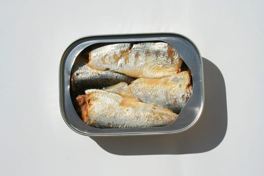 Close up of sardines in a can.
