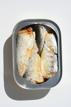 Close up of sardines in a can.
