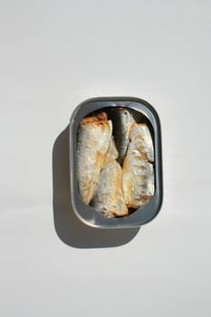 Close up of sardines in a can.
