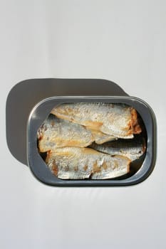 Close up of sardines in a can.
