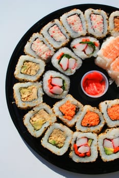 Close up of sushi assortment on a platter.
