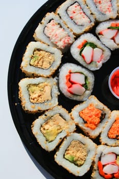 Close up of sushi assortment on a platter.
