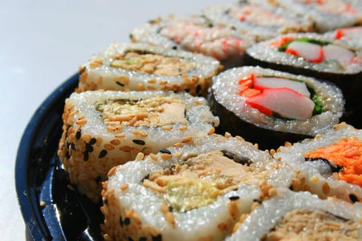 Close up of sushi assortment on a platter.
