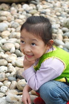 4 year old Chinese girl pretending to be model in a Beijing Park