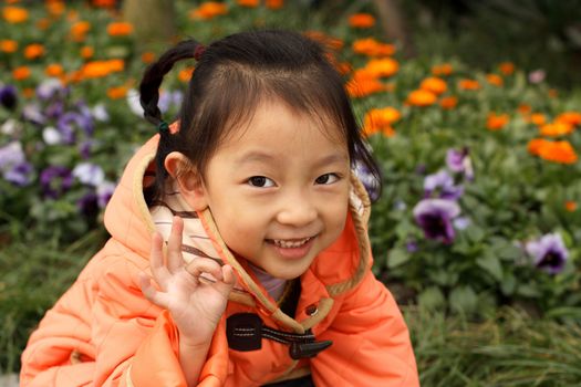 4 year old Chinese girl pretending to be model in a Beijing Park