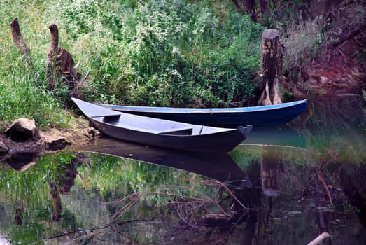two small  boats over tranquil river landscape