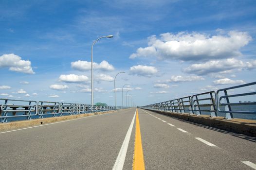 A bicycle lane on a very long bridge