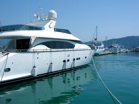 several yachts on tranquil green Adriatic sea water in Montenegro