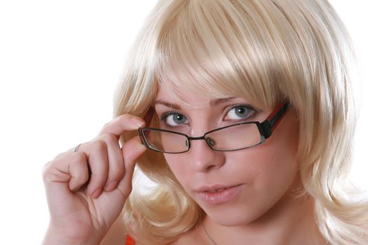 Portrait of the beautiful blonde in glasses on a white background