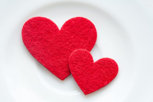 Red hearts on a plate close-up. Valentine's Day
