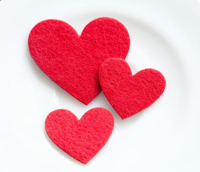 Red hearts on a plate close-up. Valentine's Day