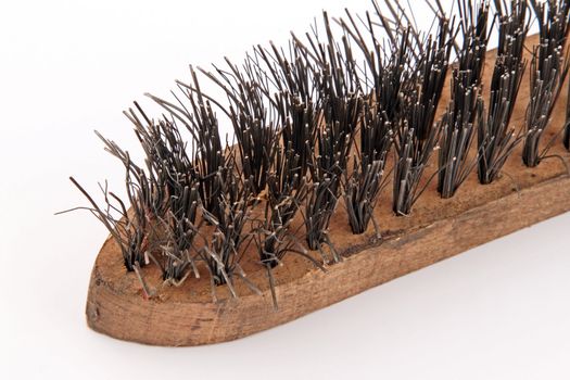 Wire brush on a plain white background
