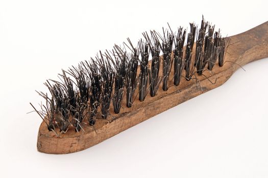 Wire brush on a plain white background