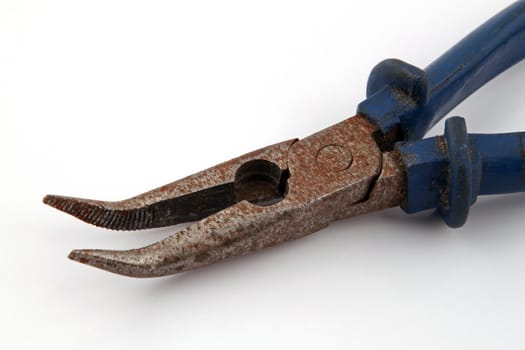 Old rusty pliers on a plain white background