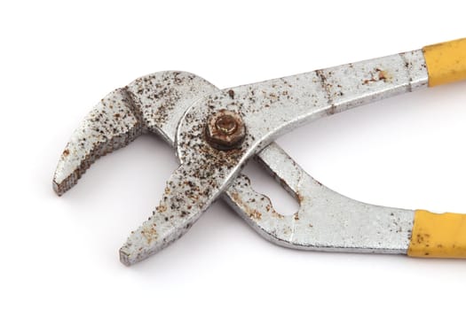 Old rusty pliers on a white background.