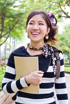 Asian woman walking in the park