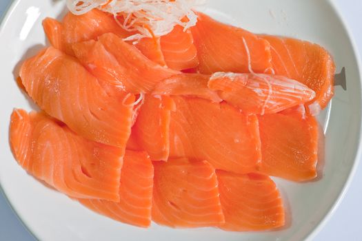 Red fish cut with slices on a dish