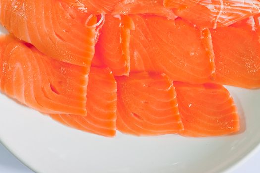 Red fish cut with slices on a dish