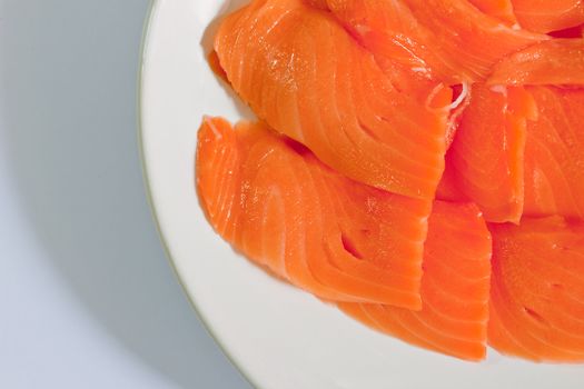 Red fish cut with slices on a dish