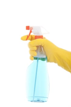 Hand in a yellow glove with blue cleaning spray.