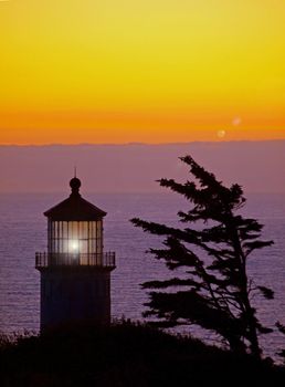 Light Shining in the North Head Lighthouse on the Washington Coast at Sunset