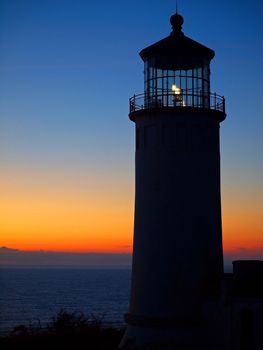 Light Shining in the North Head Lighthouse on the Washington Coast at Sunset