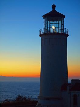 Light Shining in the North Head Lighthouse on the Washington Coast at Sunset