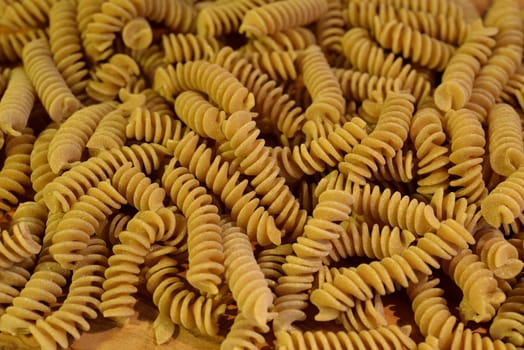 A close up of some raw fusilli