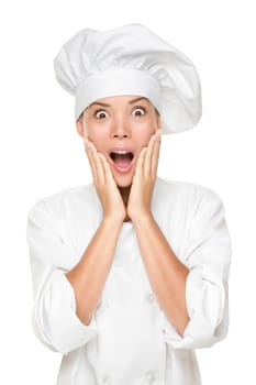 Chef or baker surprised excited and shocked. Woman in chefs uniform and hat looking at camera in shock with surprise. Beautiful young multicultural Asian / Caucasian woman chef isolated on white.
