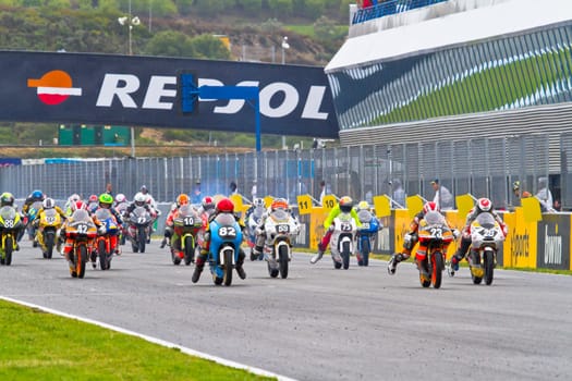 JEREZ DE LA FRONTERA, SPAIN - NOV 20: Motorbike competitors begin the 125GP - Moto3 race in the CEV Championship on November 20, 2011 in Jerez de la Frontera, Spain.